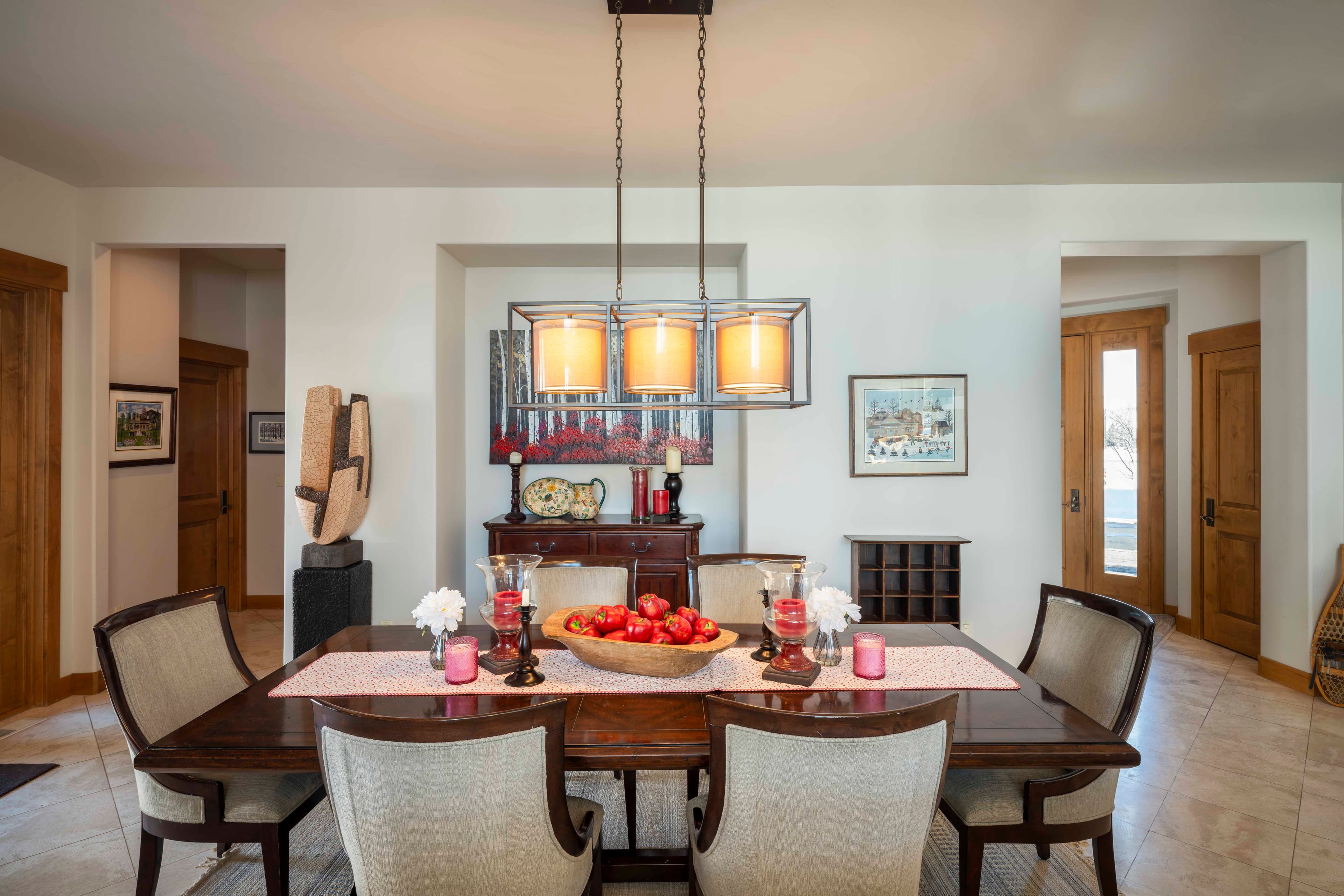 Perfect for formal meals or relaxed game nights, the dining room can accommodate 8 or more people with ease